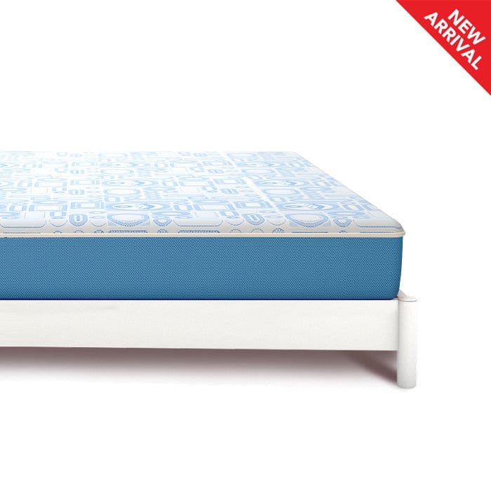 MoltyFoam Molty Junior mattress with white and light blue patterned top and blue side panel on white bed frame – labeled New Arrival